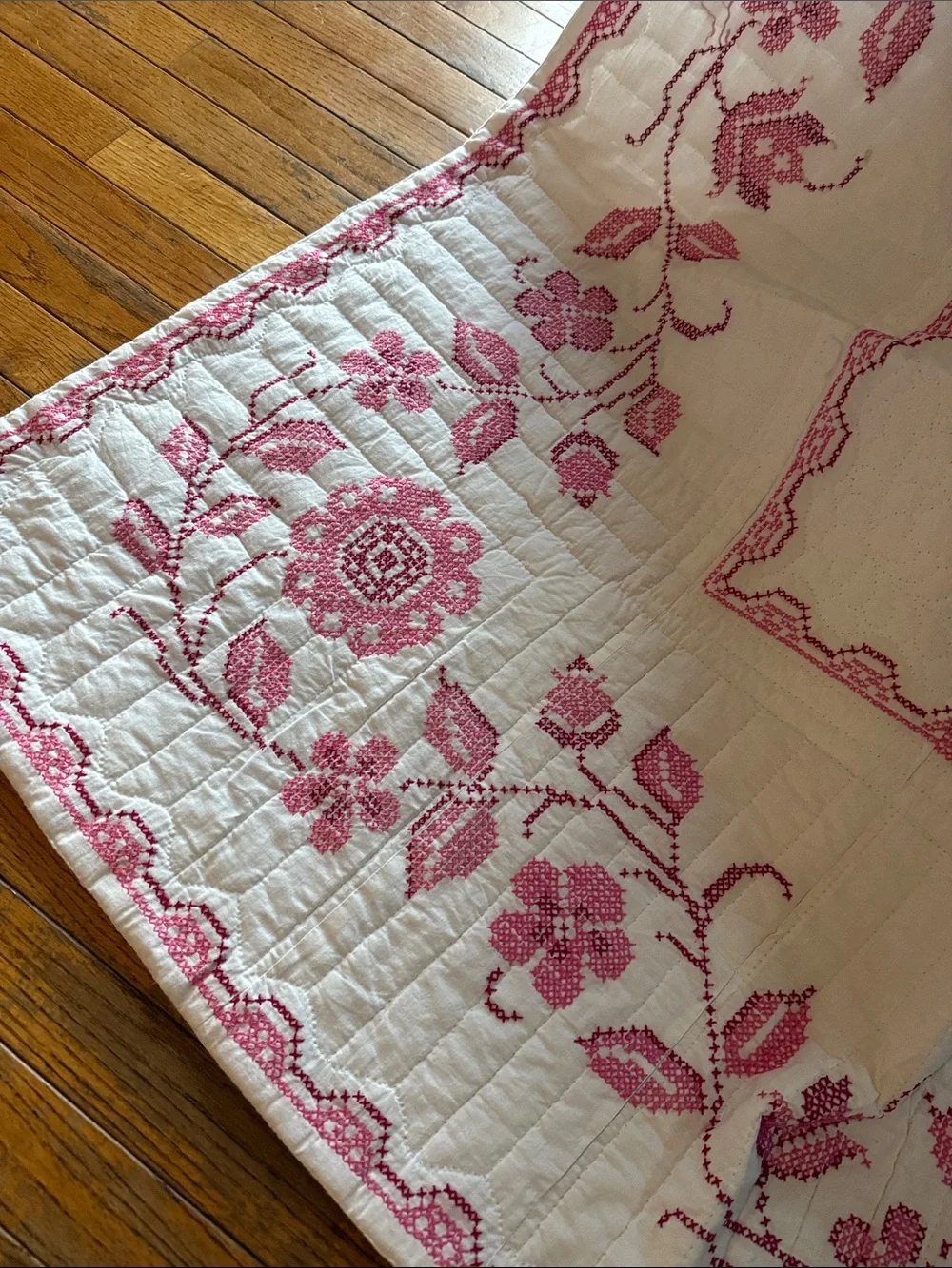 White Quilt with Pink Floral Basket Motif